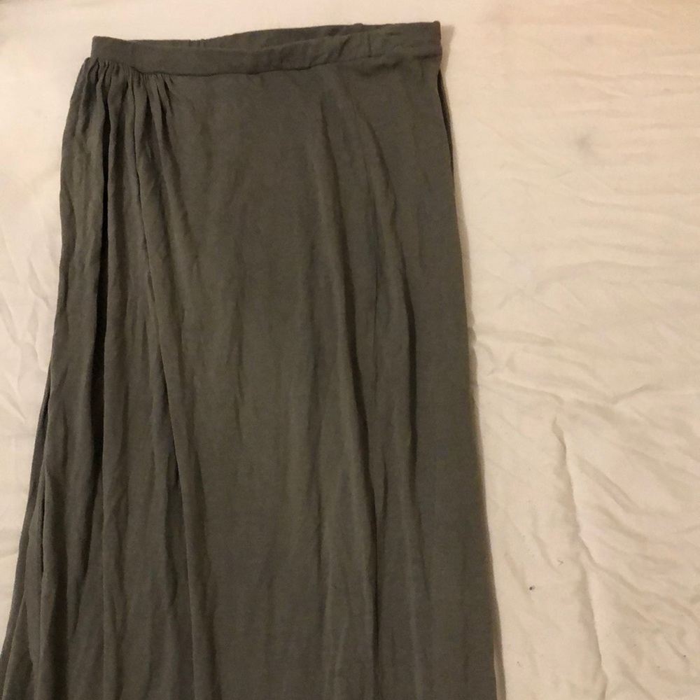 A green skirt with a side slit